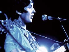 Joan Baez playing at woodstock 1969