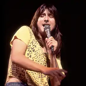 Frontman Steve Perry singing on stage