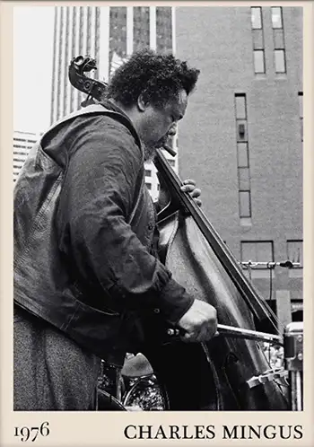 Charles Mingus playing bass outdoors with cigar in 1976